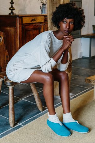 A model wearing eco friendly ethical slippers from Babuuk.